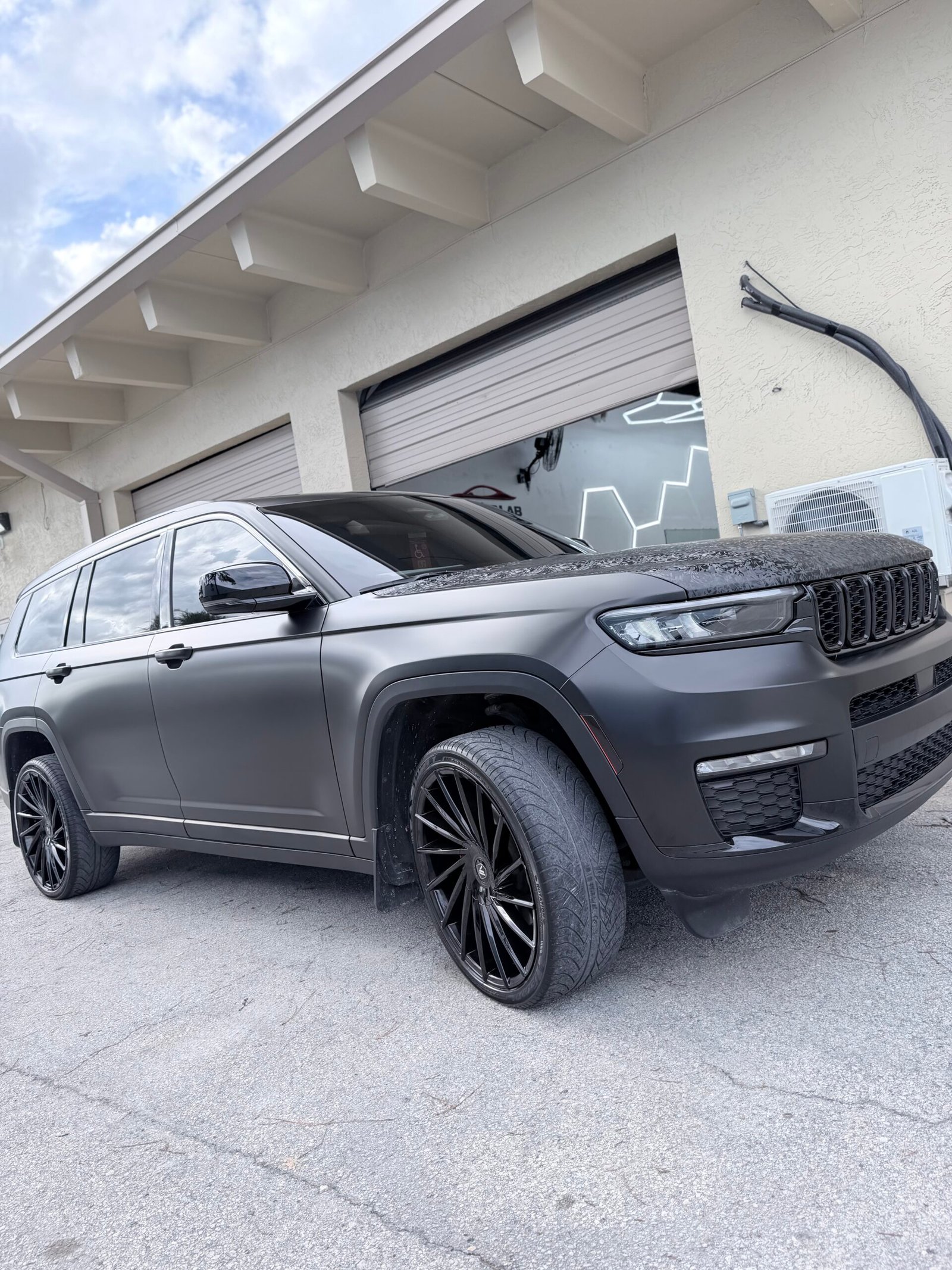 Satin black Jeep vehicle wrap at HQ Auto Lab
